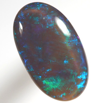 SOLID BLACK CRYSTAL OPAL Rolling flashes of green and turquoise purple fire